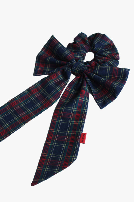 Plaid bow with a red tag on a white background