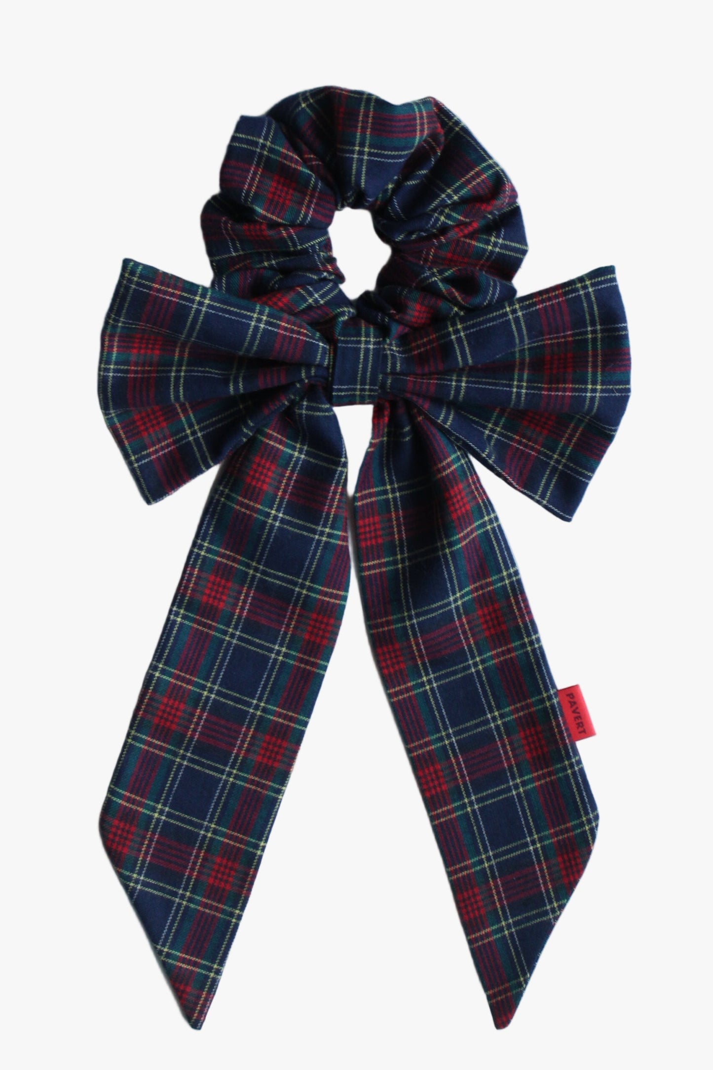 Plaid bow scrunchie on a light blue background