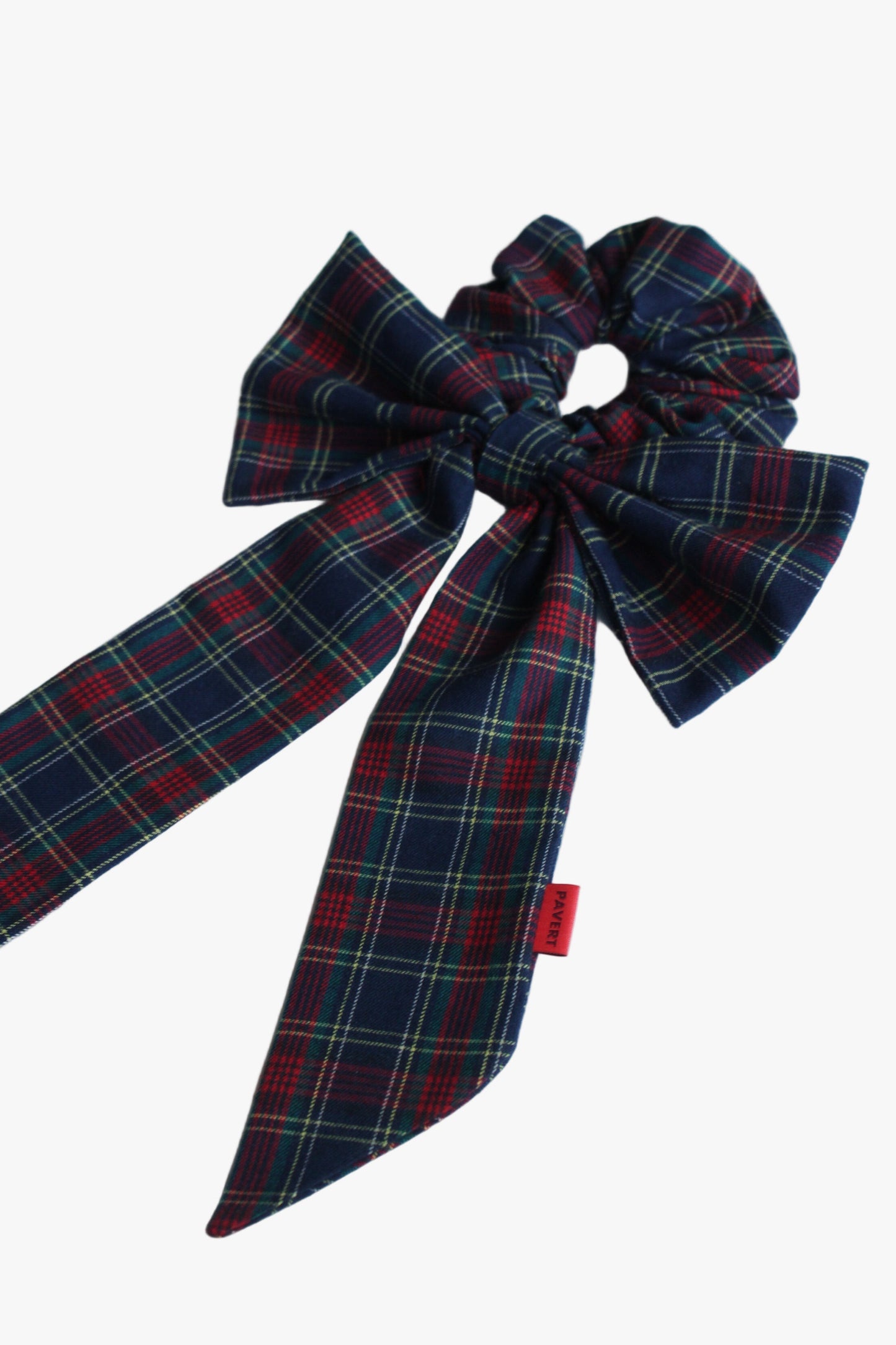 Plaid bow with a red tag on a white background