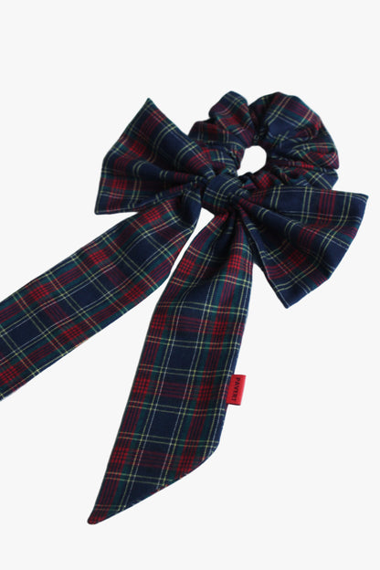 Plaid bow with a red tag on a white background