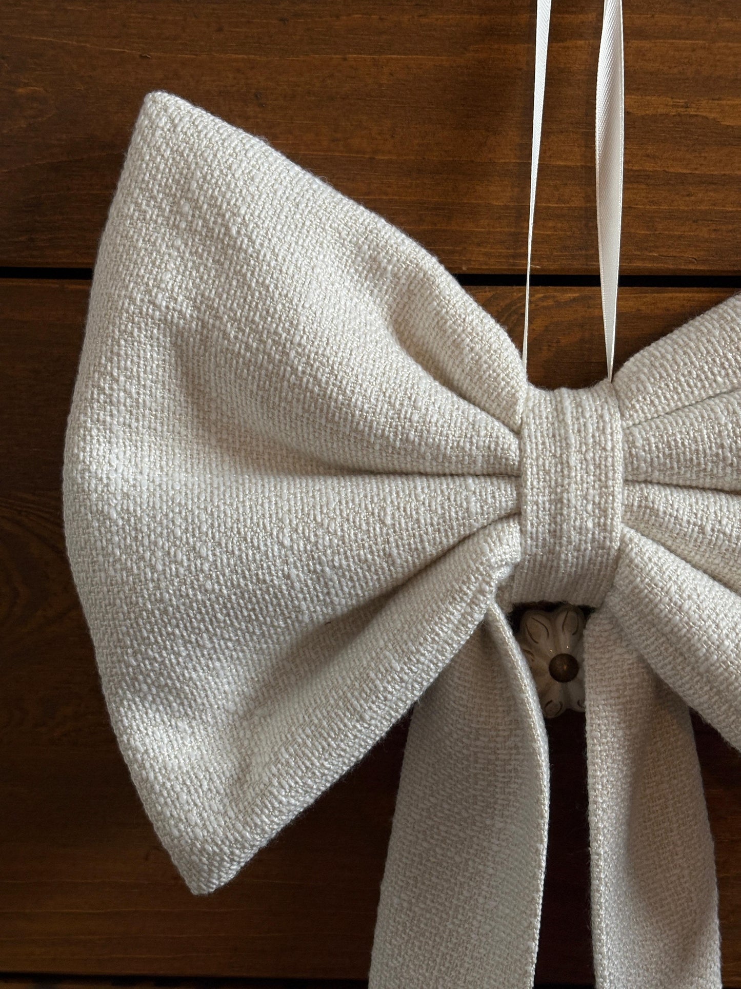 Off white boucle bow